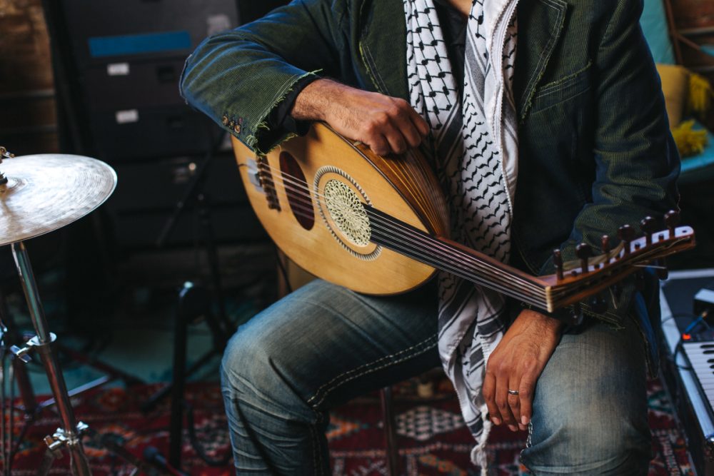 A person holds an oud